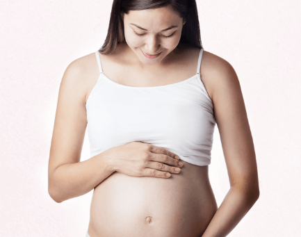 Pregnant woman holding her belly